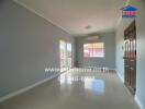 Bright living room with large windows and balcony access