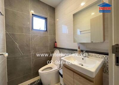 Modern bathroom with tiled walls