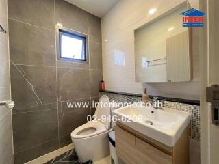 Modern bathroom with tiled walls