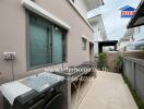 Outdoor laundry and utility area with sink and counter space