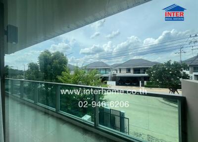 View from a balcony overlooking a residential neighborhood