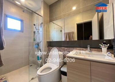 Modern bathroom with glass shower and vanity