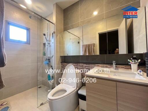 Modern bathroom with glass shower and vanity