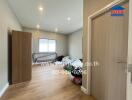 Bedroom with wooden flooring and natural light