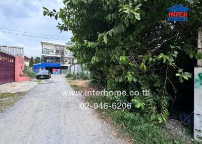 Driveway view with building in the background