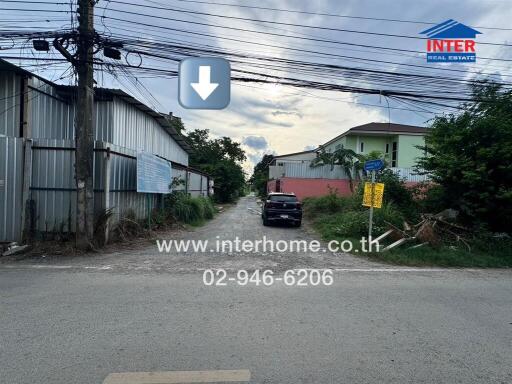 Street view with buildings and a parked car