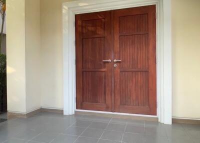 front entrance with wooden double doors