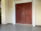 front entrance with wooden double doors