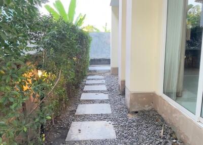 Outdoor walkway with pebble stones and stepping stones