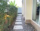 Outdoor walkway with pebble stones and stepping stones