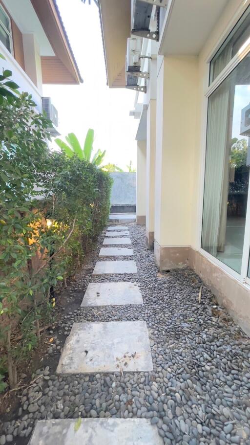 Outdoor walkway with pebble stones and stepping stones