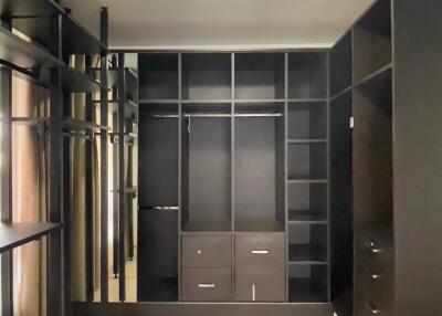 Spacious walk-in closet with ample storage