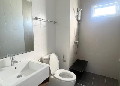 Modern bathroom with white sink and toilet