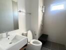 Modern bathroom with white sink and toilet