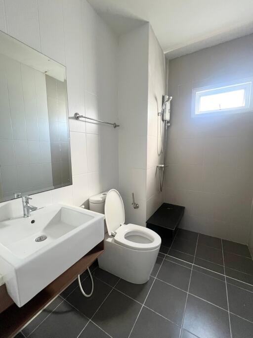 Modern bathroom with white sink and toilet