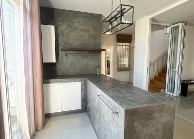 Modern kitchen with island and natural lighting