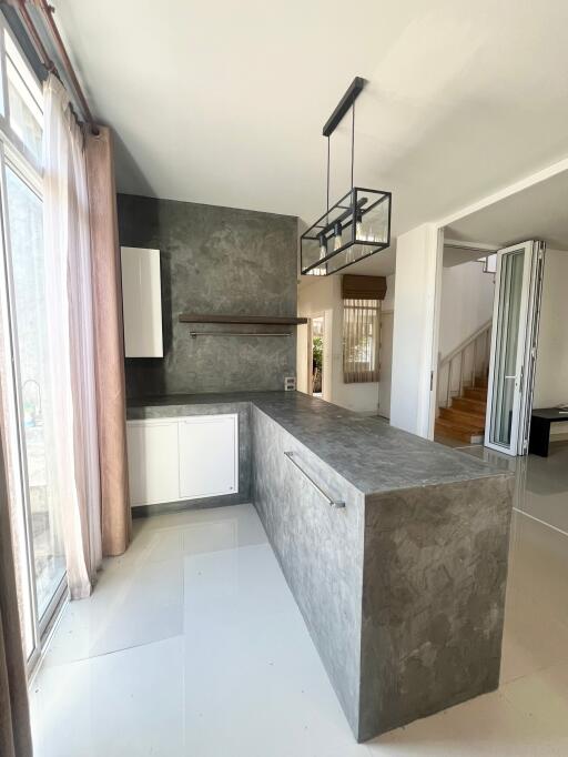 Modern kitchen with island and natural lighting