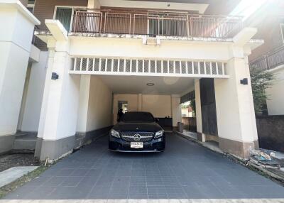 Covered carport with a car