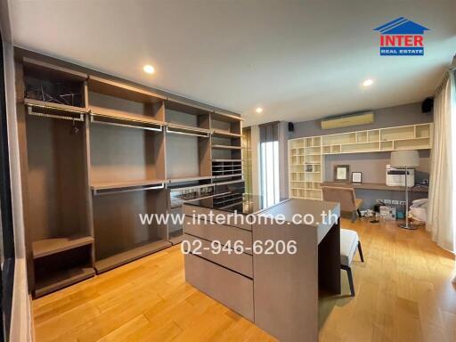 Spacious bedroom with built-in wardrobes and study area