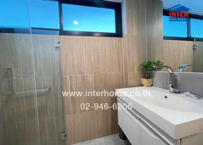 Modern bathroom with sink and shower enclosure