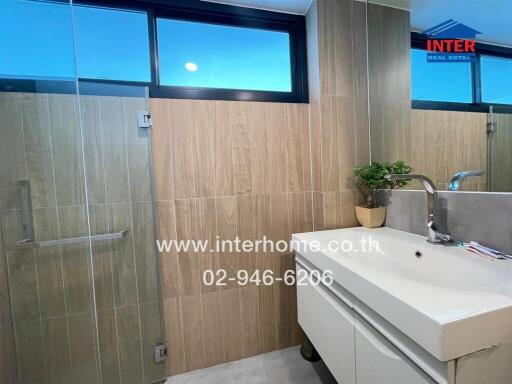 Modern bathroom with sink and shower enclosure