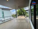 Spacious balcony with seating area and city views