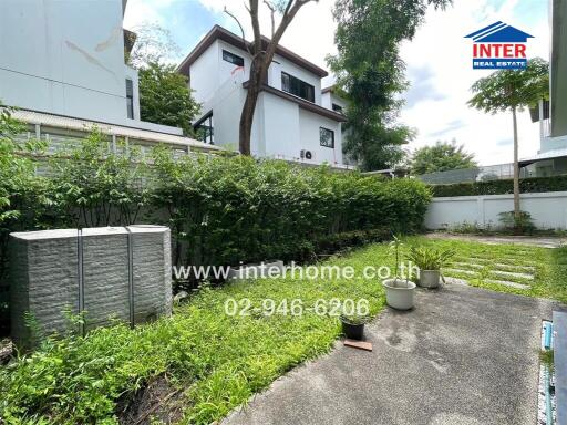 Outdoor garden area with pathway and greenery