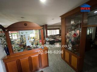 Spacious living room with decorative wooden cabinet