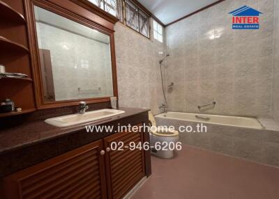 Bathroom with sink, mirror, and bathtub