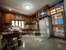 Spacious kitchen with wooden cabinets and modern appliances