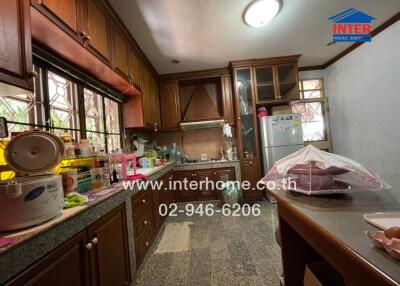 Spacious kitchen with wooden cabinets and modern appliances