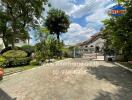 Front yard with gated entrance and garden