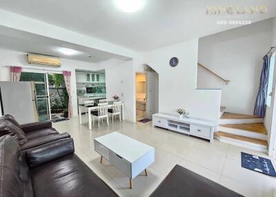 Living room with open kitchen and dining area