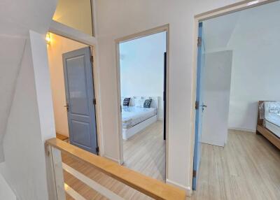 Hallway leading to two bedrooms