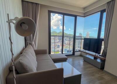 Modern living room with large windows and city view