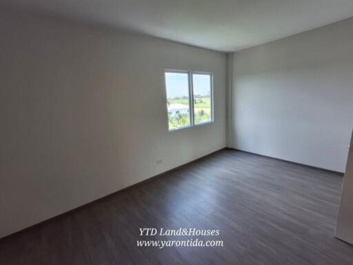 Spacious bedroom with large windows