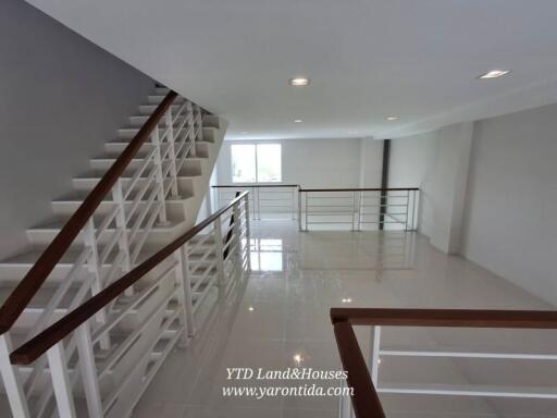 Spacious modern staircase with sleek railings