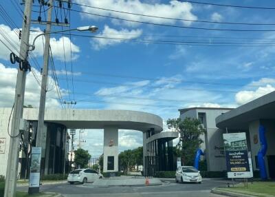 Main entrance to the residential property with clear blue skies