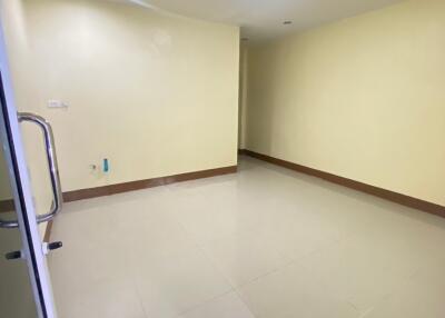 Empty room with tiled floor and ceiling light