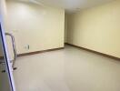 Empty room with tiled floor and ceiling light