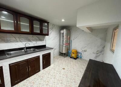 Modern kitchen with marble countertop and ample storage