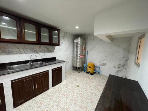 Modern kitchen with marble countertop and ample storage