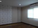 Spacious bedroom with air conditioning and window blinds