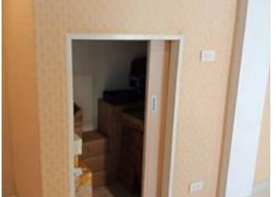 Small storage room with sliding door