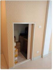 Small storage room with sliding door