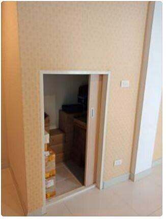 Small storage room with sliding door