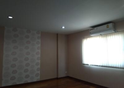 Bedroom with air conditioning and window blinds