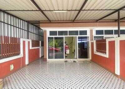 Covered patio area with tiled flooring