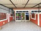 Covered patio area with tiled flooring