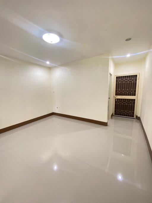 main living area with bright lighting and clean floors